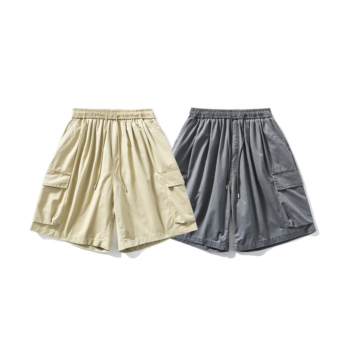 Beige and charcoal gray wide-leg cargo shorts shown from the front, with elastic drawstring waists and large side pockets.