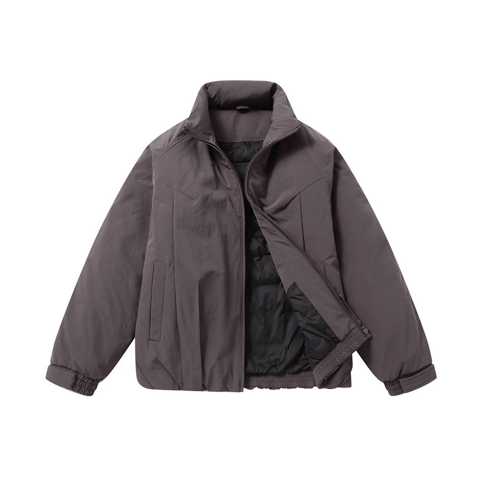 Dark charcoal-gray jacket shown open from the front, with a stand collar, black lining, zip closure, and elasticated cuffs