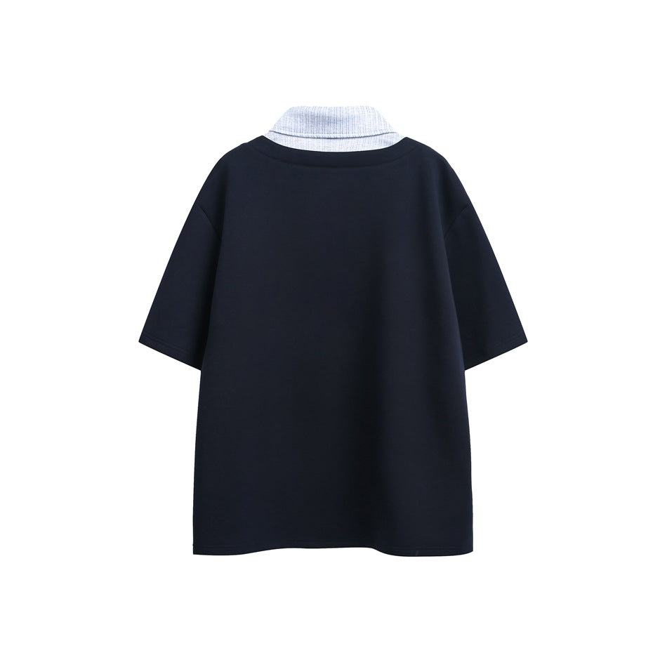 Back view of a dark navy short-sleeve polo shirt with a light gray textured collar.