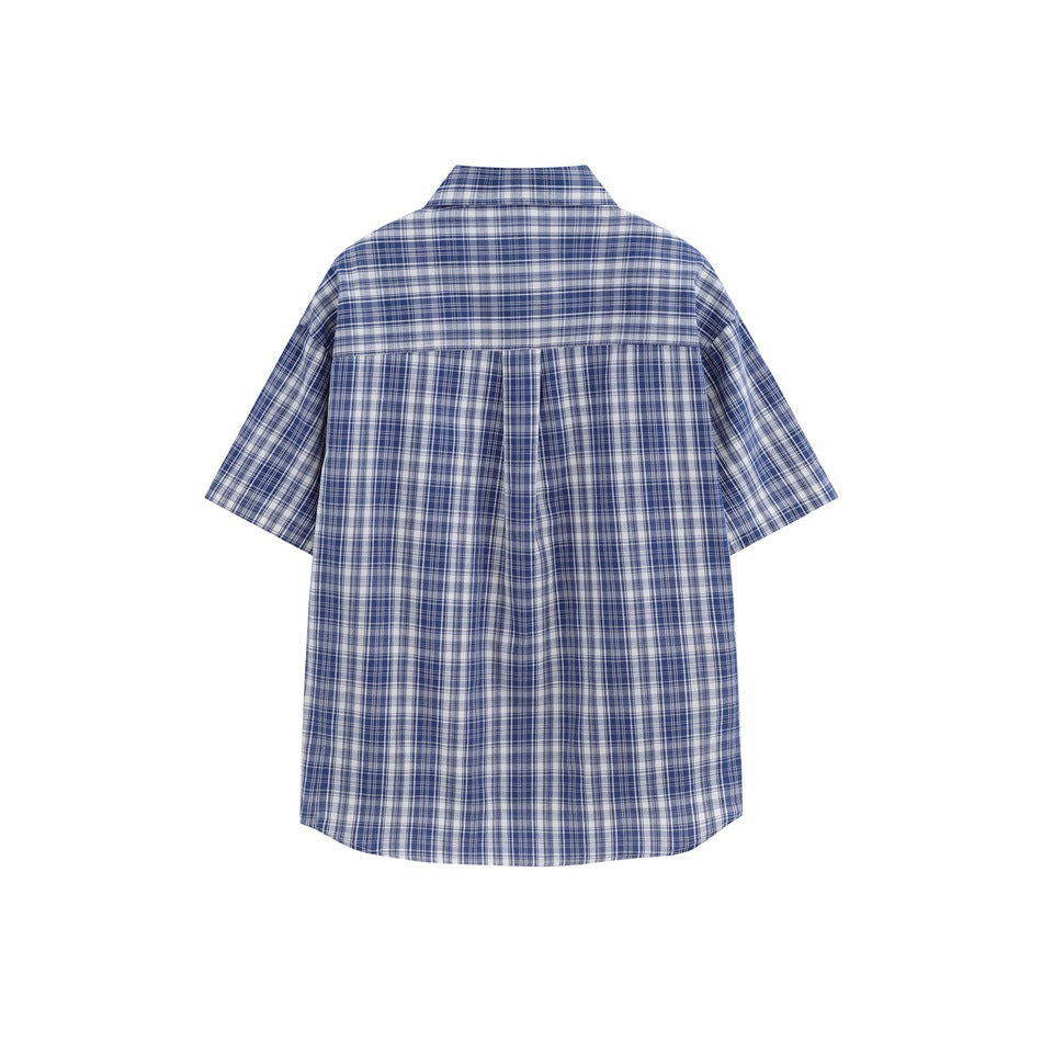Back view of a deep blue plaid short-sleeve shirt with a back yoke and center pleat, flat lay
