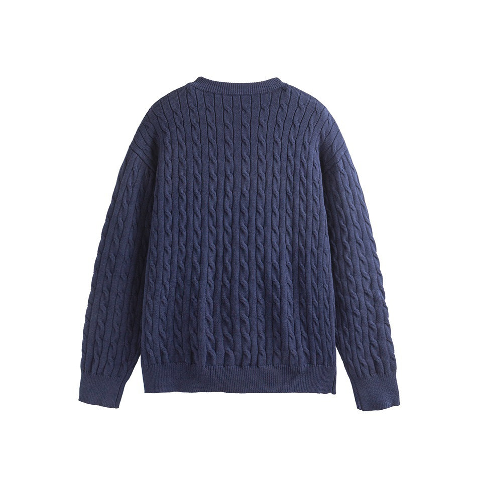 Back view of a navy cable-knit crewneck sweater with ribbed neckline, cuffs, and hem.