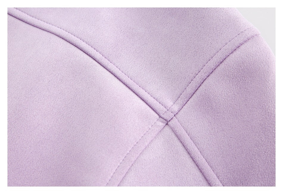 Lavender garment close-up showing intersecting raised seam lines.