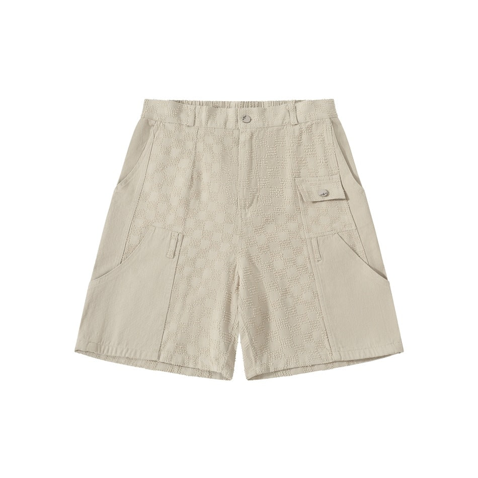 Off-white knee-length shorts with checkerboard jacquard center panels, flap pocket and button closure, flat front view