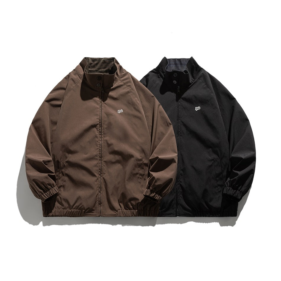 Brown and black zip-front jackets displayed side by side, each with a stand collar and elastic cuffs.