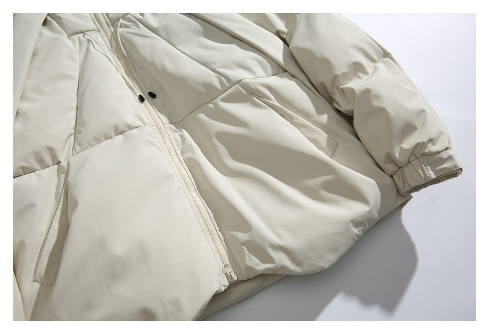 Off-white jacket laid flat, showing its front zipper, panel seams, pockets, and gathered cuffs.