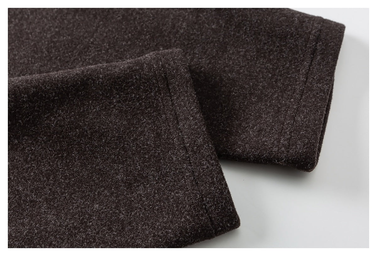 Close-up of a folded edge and seam on the dark brown jacket.
