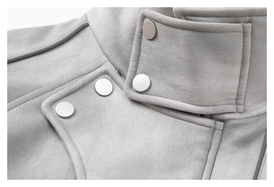 Close-up of the light gray coat's overlapping front panels and large round snap buttons.