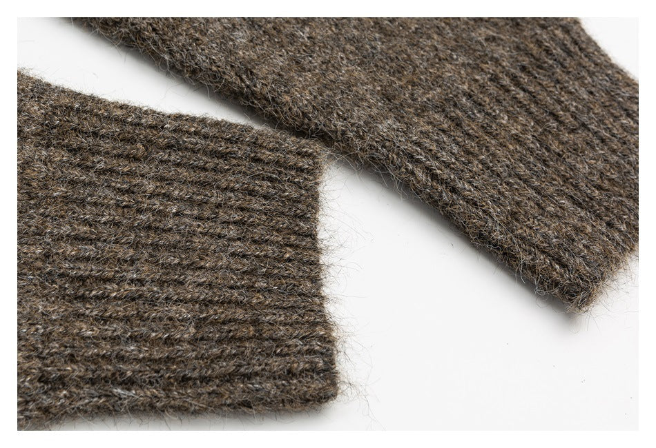 Close-up of a brown fuzzy knit sleeve and ribbed cuff laid flat on a white background.