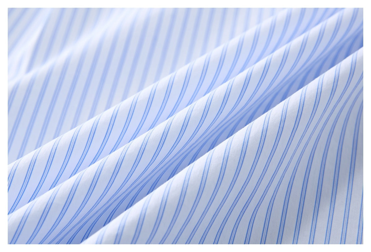 Close-up of white fabric with fine blue stripes draped into soft folds.
