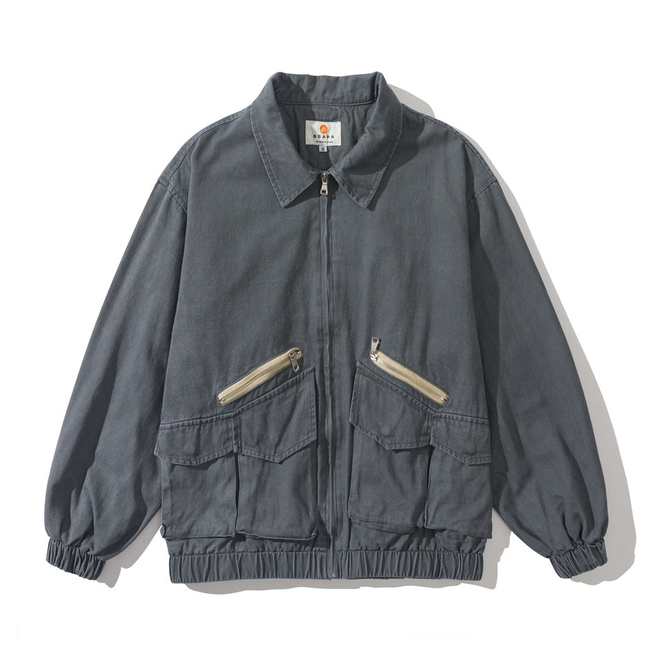 Gray washed collared zip jacket, flat front view, with large flap pockets, beige diagonal zips and elastic cuffs and hem