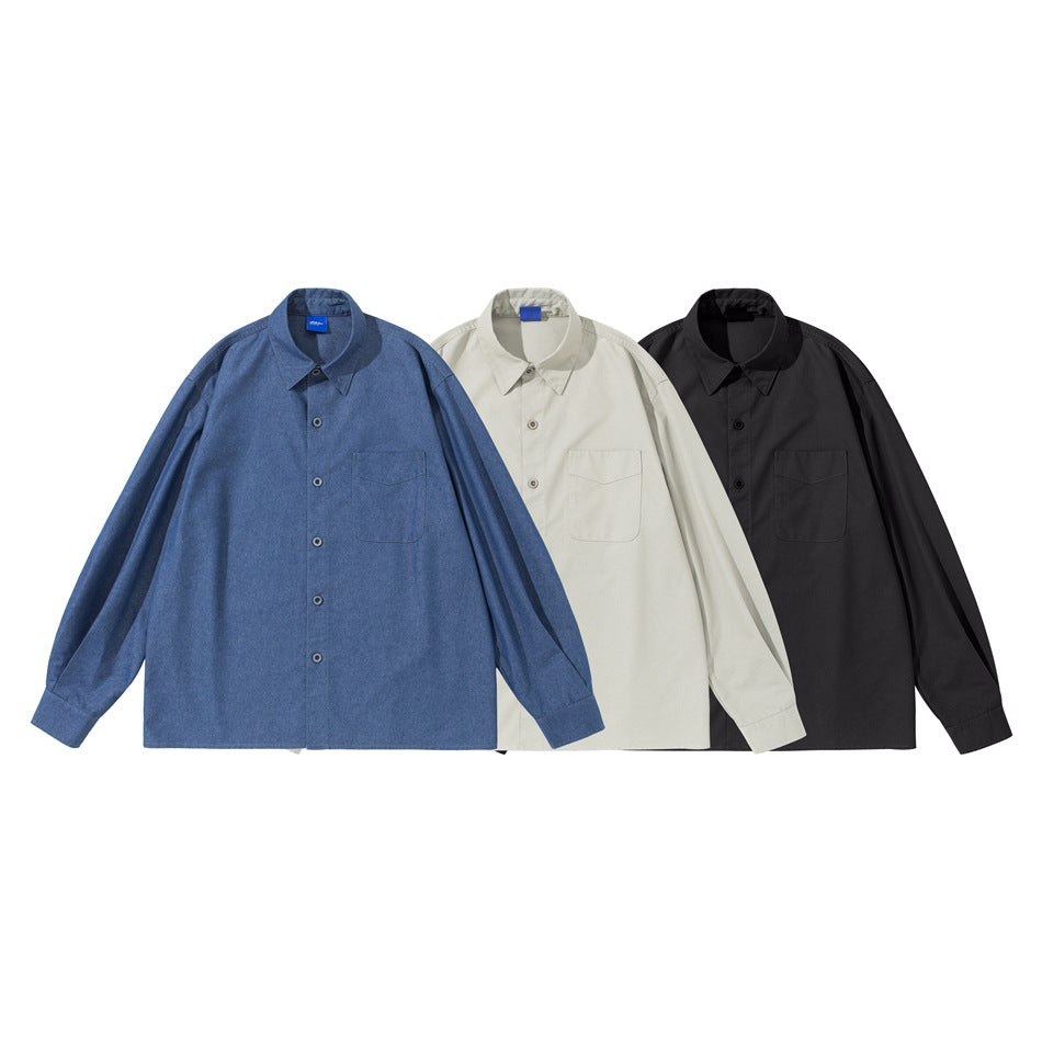 Three long-sleeve button-up shirts with chest pockets, shown in blue, off-white and black.