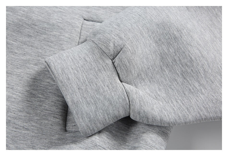 Close-up of a heather gray sleeve cuff and seam.