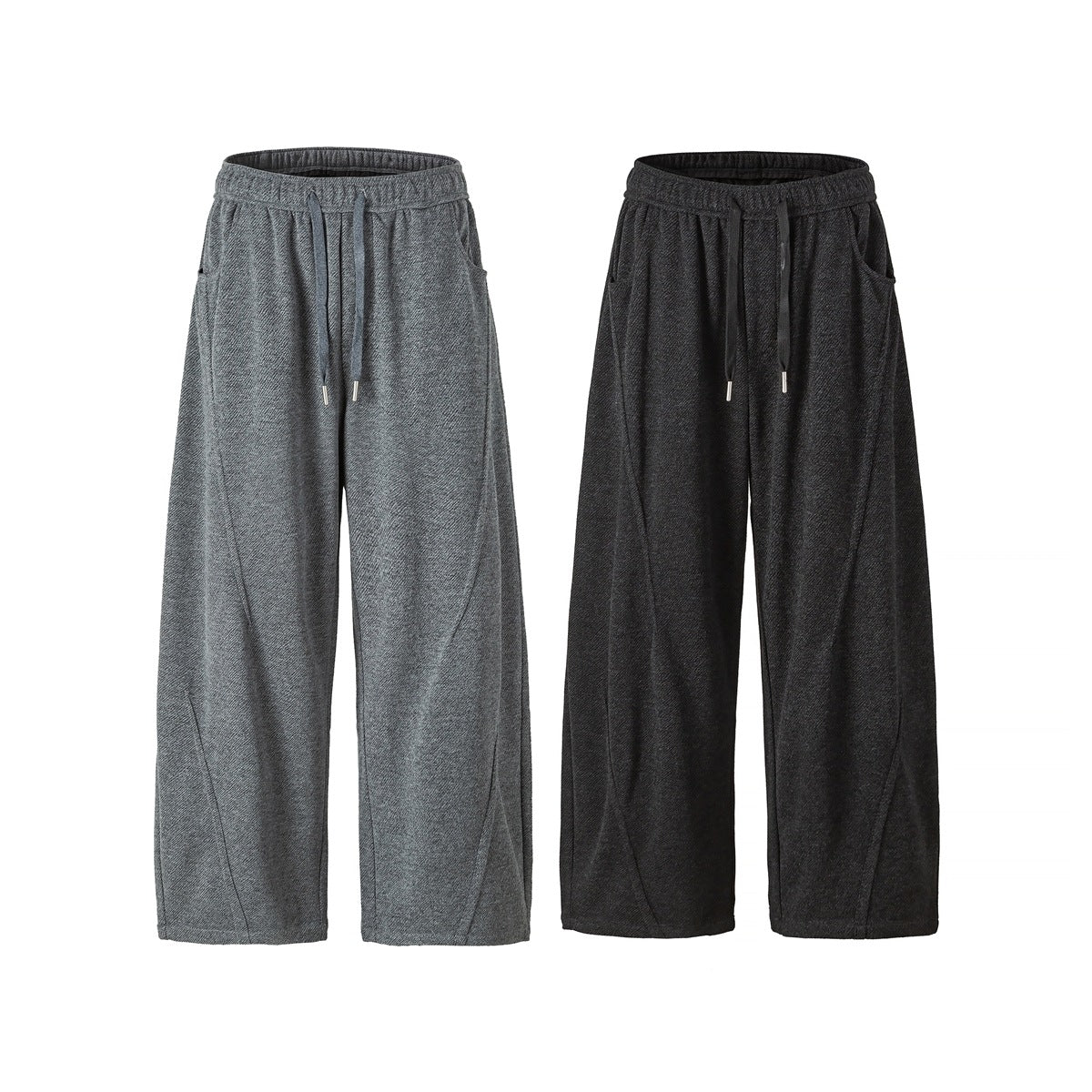Front view of wide-leg drawstring pants in gray and charcoal, with elastic waists and side pockets.