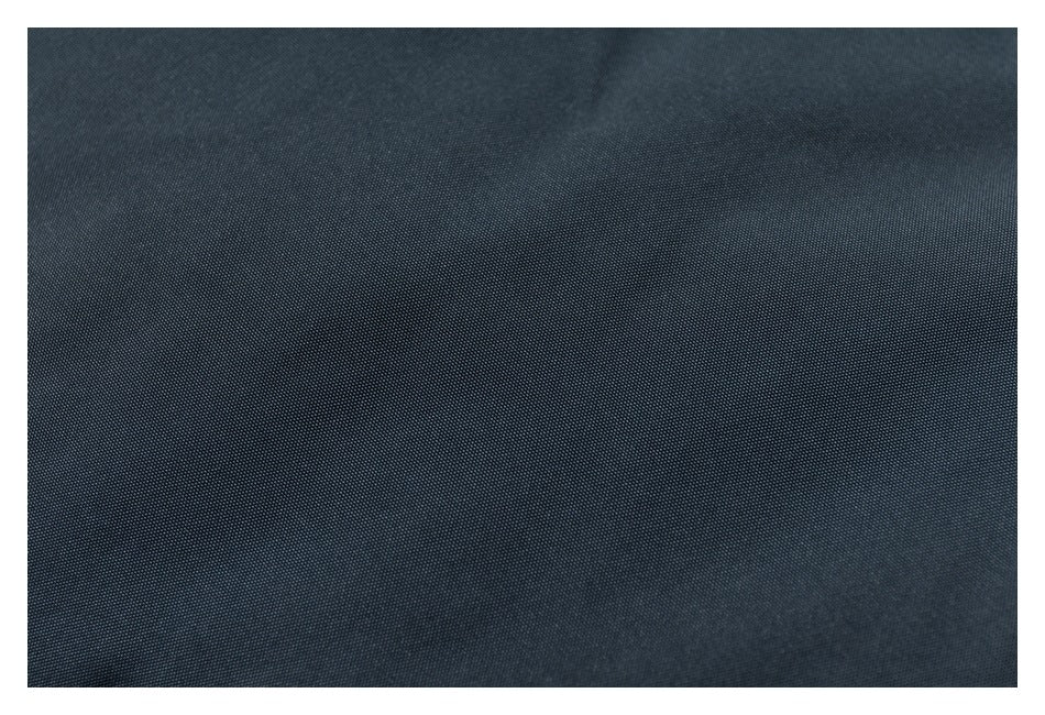 Close-up of dark navy fabric showing its fine woven texture.