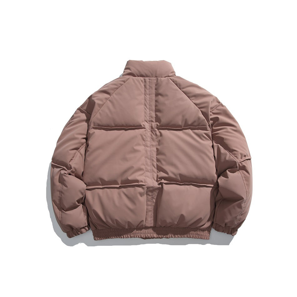 Back view of a dusty mauve puffer jacket with a high collar, grid quilting, elastic cuffs and gathered hem.
