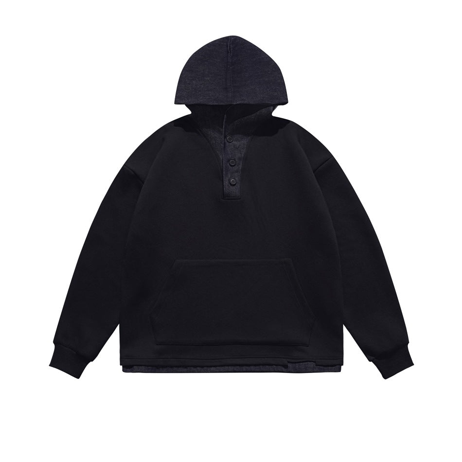 Black pullover hoodie with dark denim-look hood, button placket, front pouch pocket and layered hem, flat front view