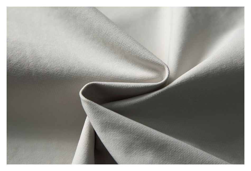 Close-up of light gray fabric folded to show its surface texture.