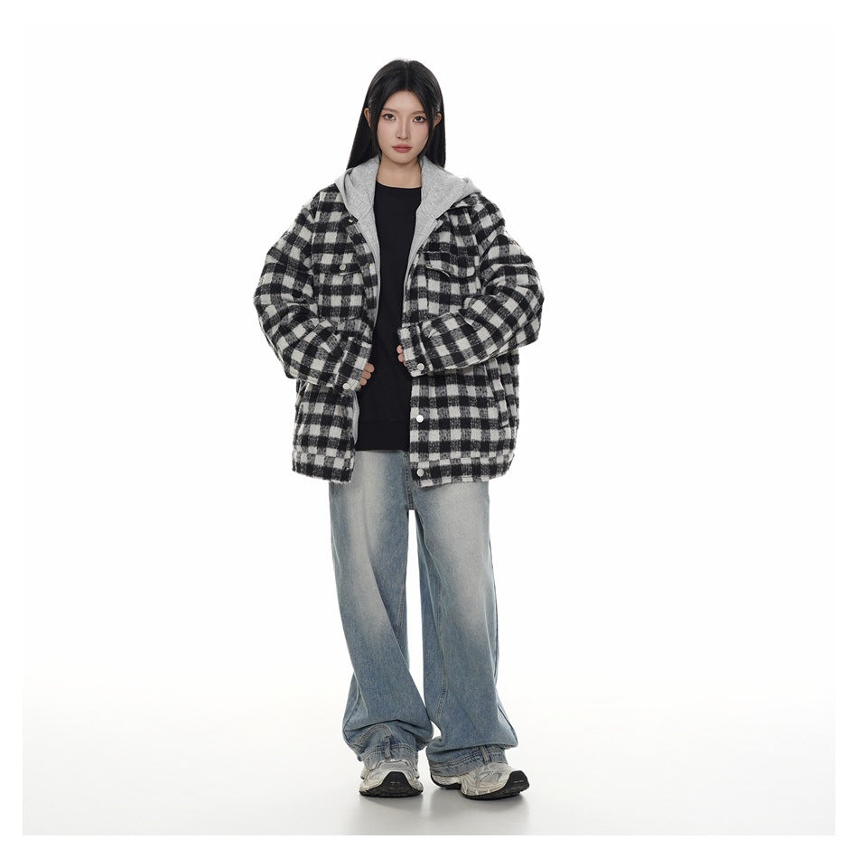 Full-length model wearing a black-and-white plaid hooded jacket with loose light-wash jeans.