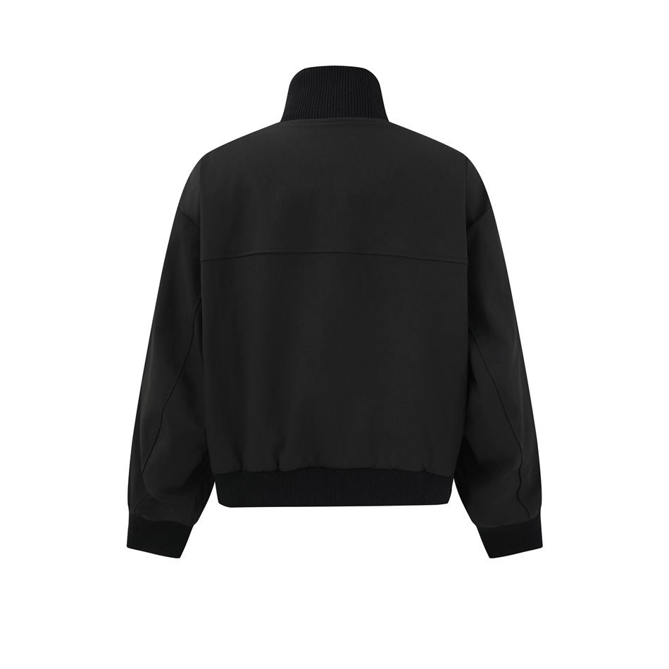 Back view of a black jacket with a ribbed stand collar, cuffs, and hem.