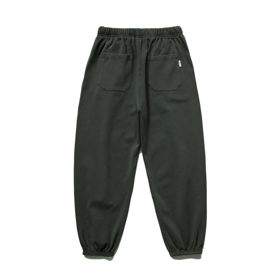 Back view of dark green sweatpants showing two patch pockets, elastic waistband and cuffed ankles