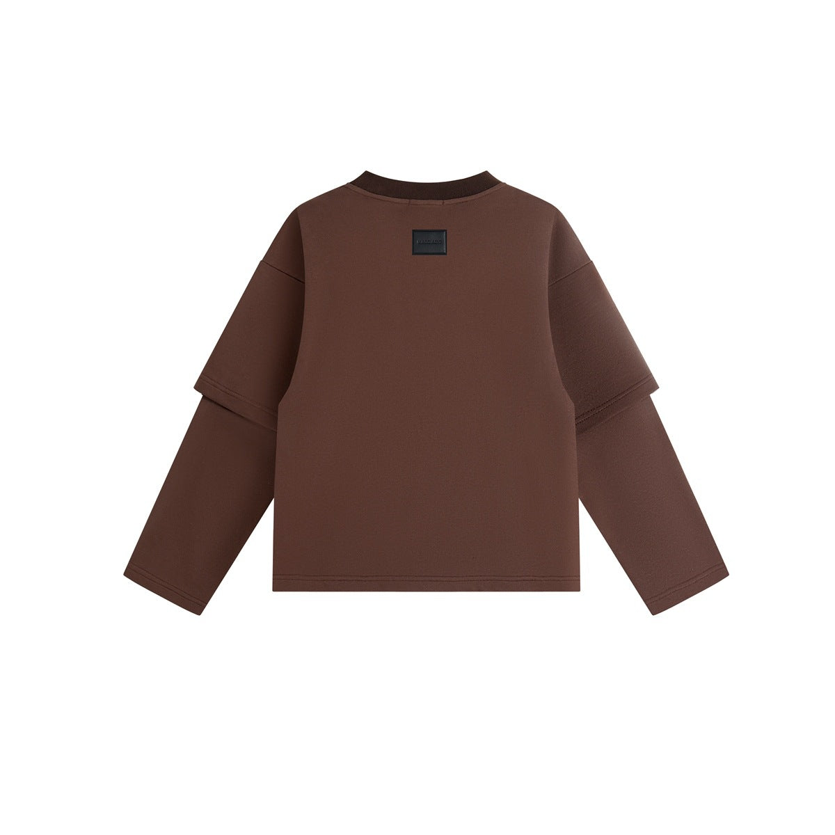 Back view of a brown crewneck shirt with layered long sleeves and a small rectangular patch near the neckline.