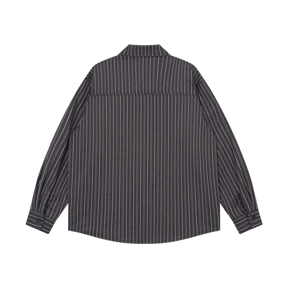 Back view of black striped long-sleeve shirt with yoke seam and button cuffs
