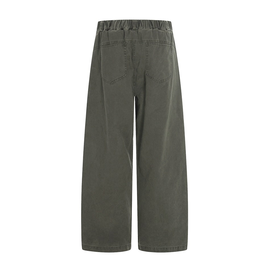Back view of dark gray wide-leg trousers with an elasticated waistband and two rear patch pockets.