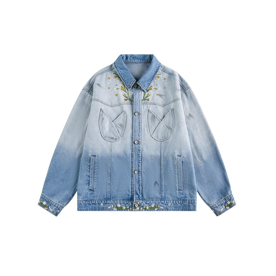 Blue ombre denim jacket with floral embroidery, tulip chest pockets and button front on a white background