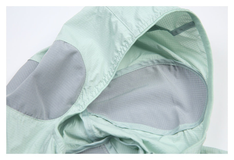 Close-up of the pale mint hood interior with curved gray panels.