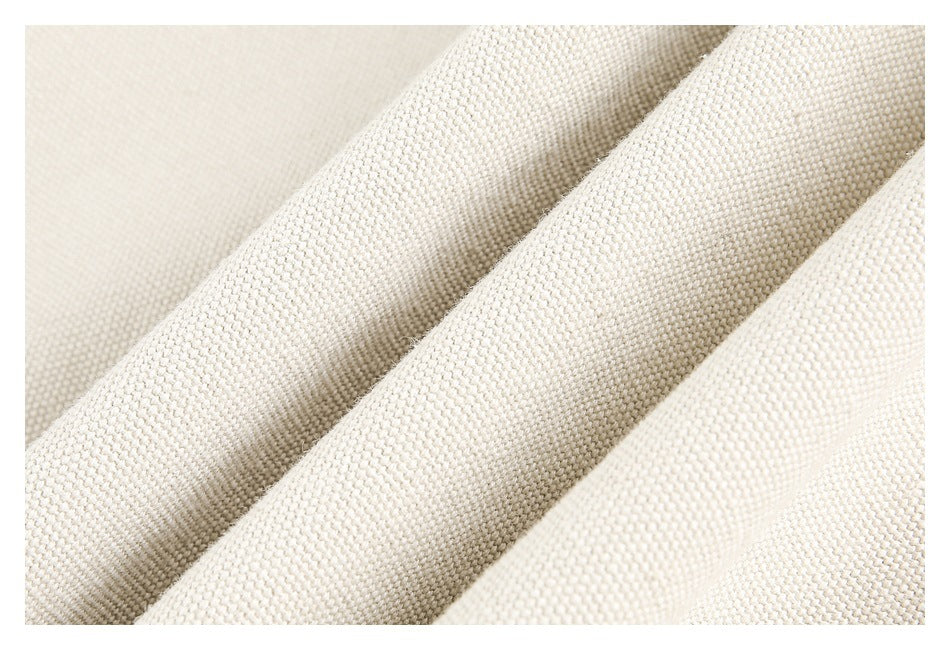 Close-up showing the textured weave and soft folds of cream fabric.