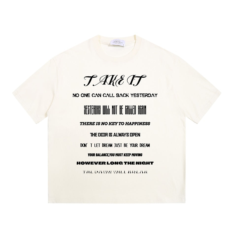 Apricot cream short-sleeve crew-neck T-shirt with black 'TAKE IT' slogan typography print on the front, flat lay