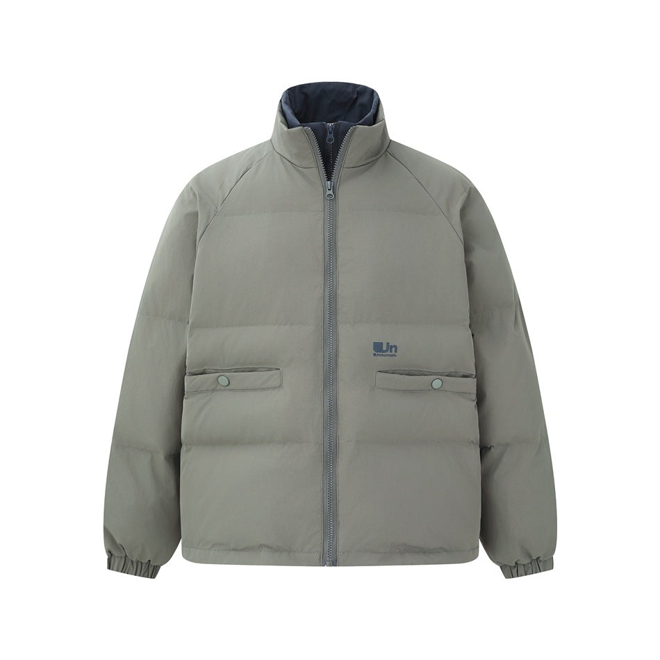 Gray-green quilted stand-collar zip jacket with snap-flap pockets and navy inner collar, flat front view