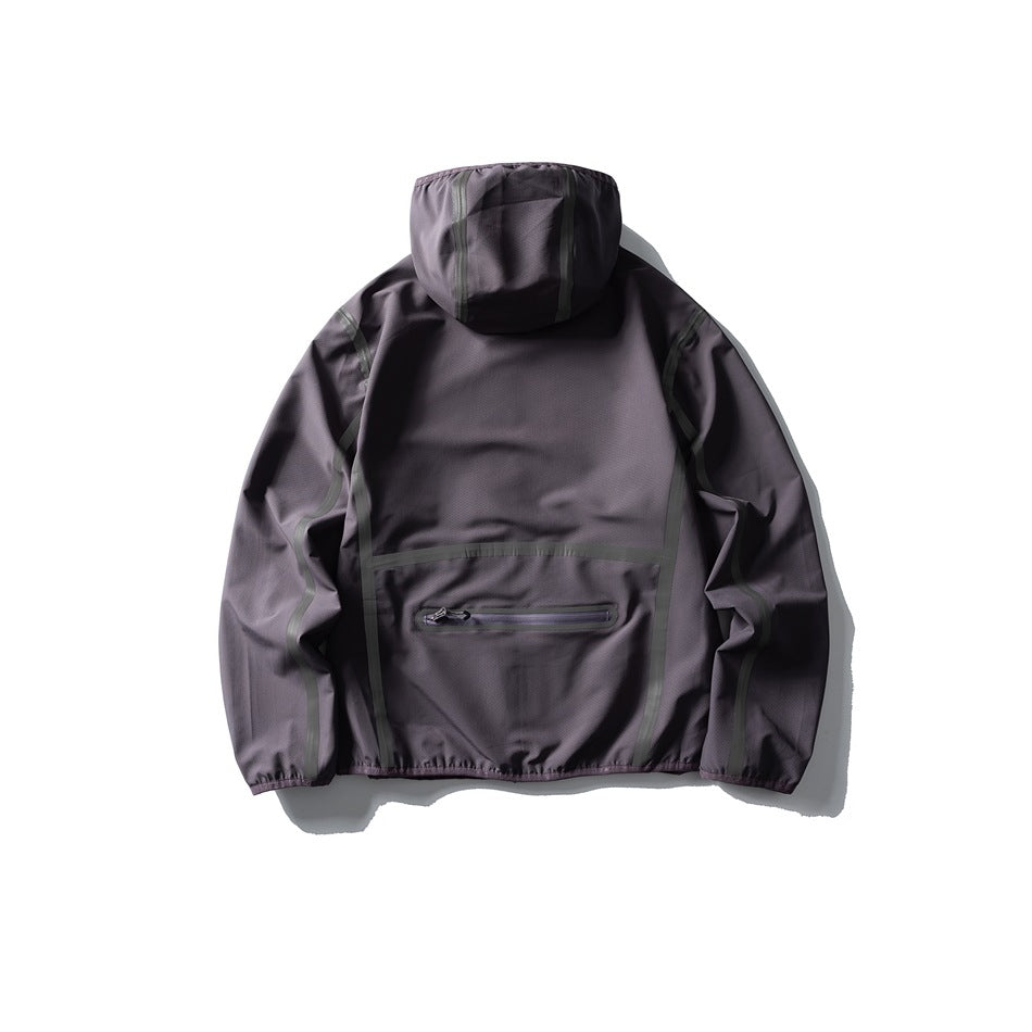 Back view of a charcoal-gray hooded pullover with dark seam trim and a horizontal zip pocket.