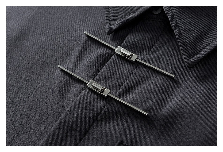 Close-up of two silver-toned bar fasteners on the charcoal shirt's front placket.