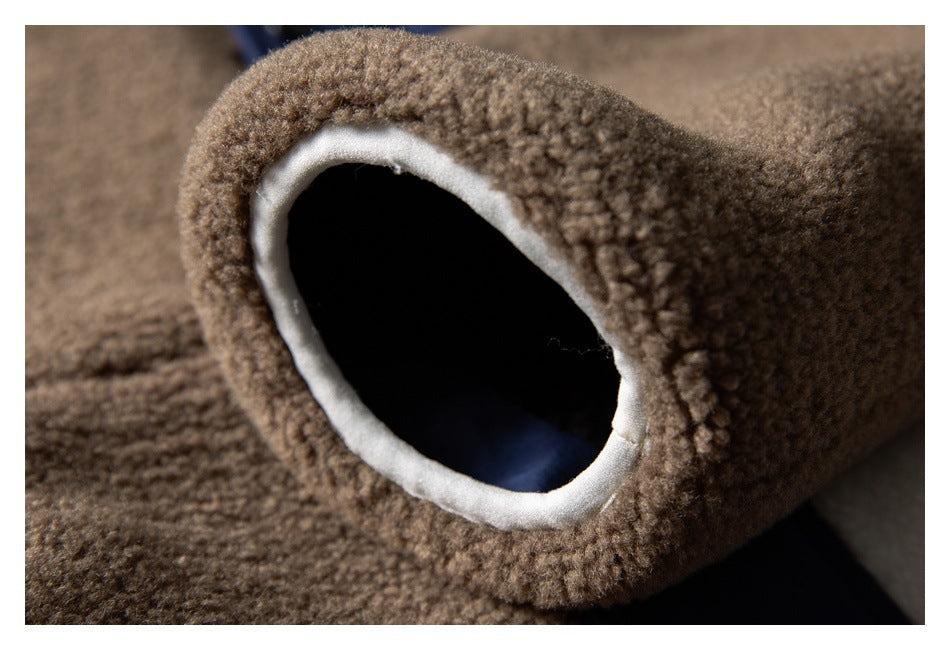 Close-up of a brown fuzzy garment opening edged with cream fabric.