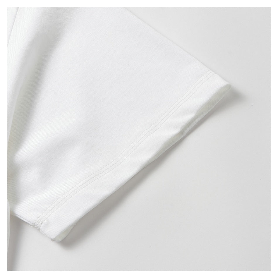 Close-up of the hem and double stitching on a white garment sleeve.