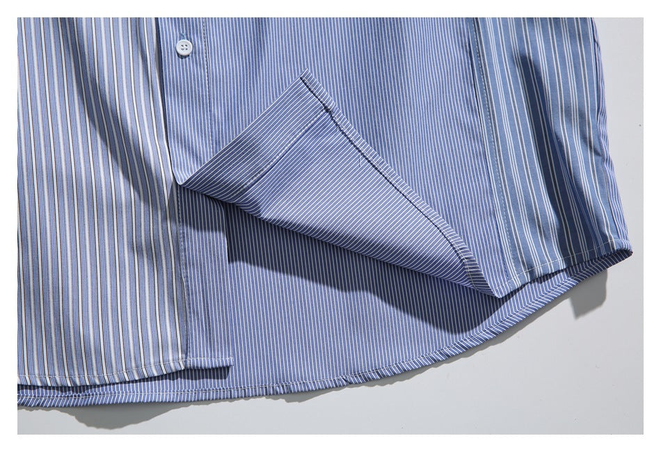 Close-up of the shirt hem with a section of blue-and-white striped fabric folded back.