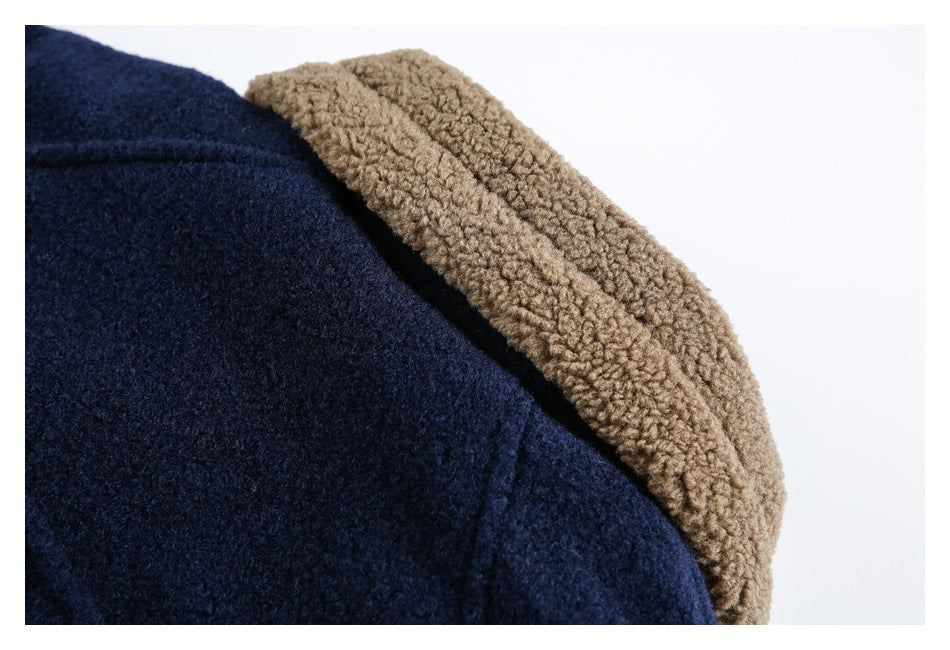 Close-up showing dark navy fabric beside a tan curly-textured collar lining.