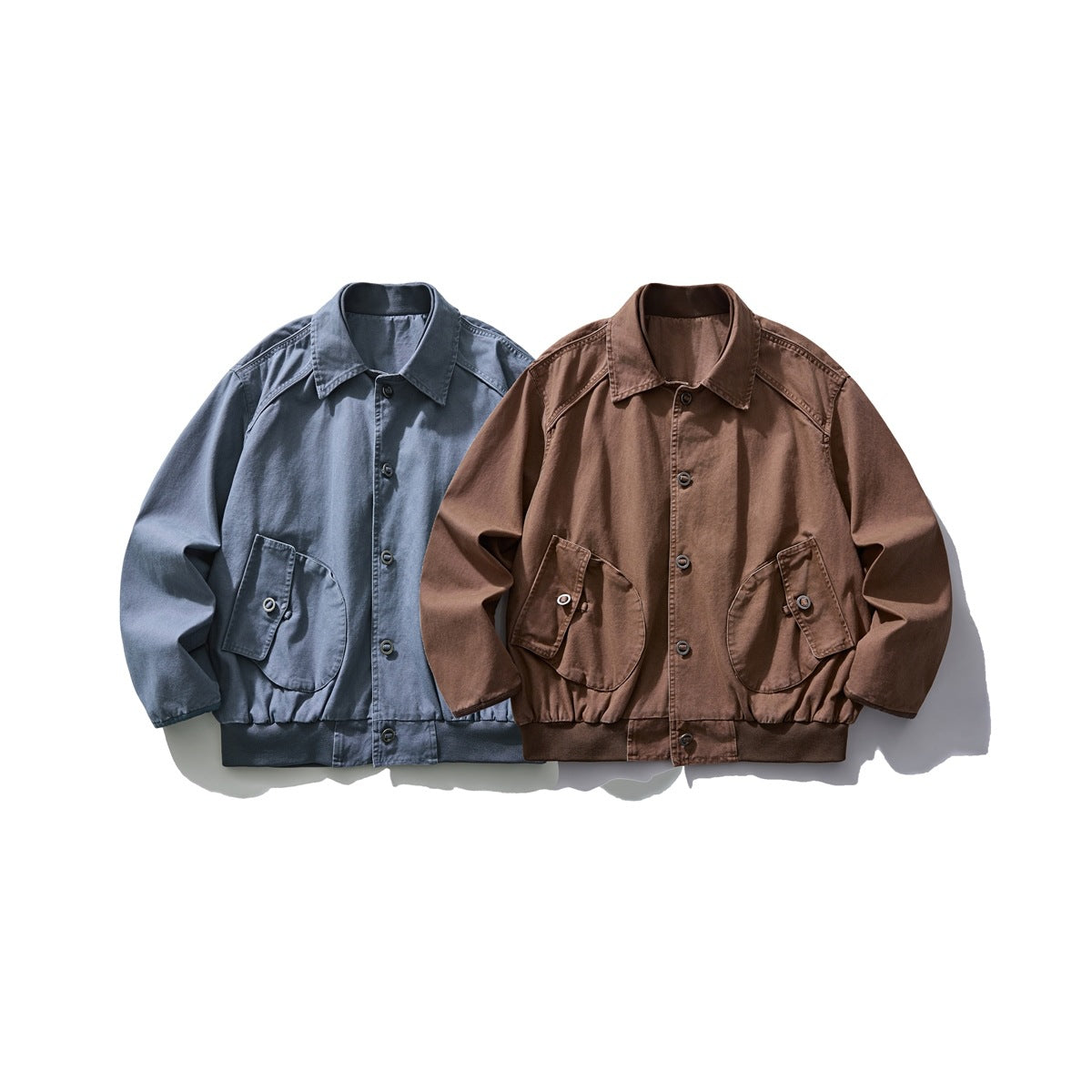 Two front-view collared jackets with button closures and large flap pockets, in blue and brown.