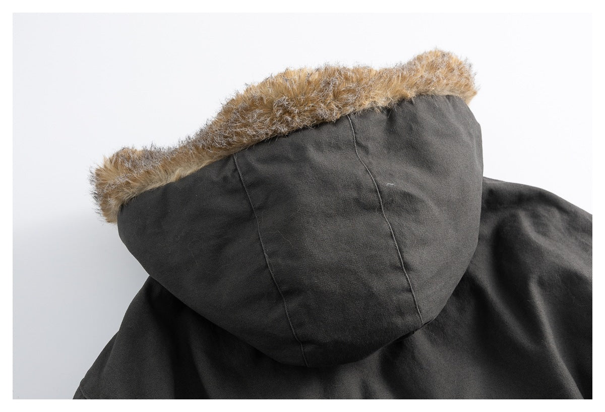 Back close-up of a dark charcoal hood with tan faux-fur trim.