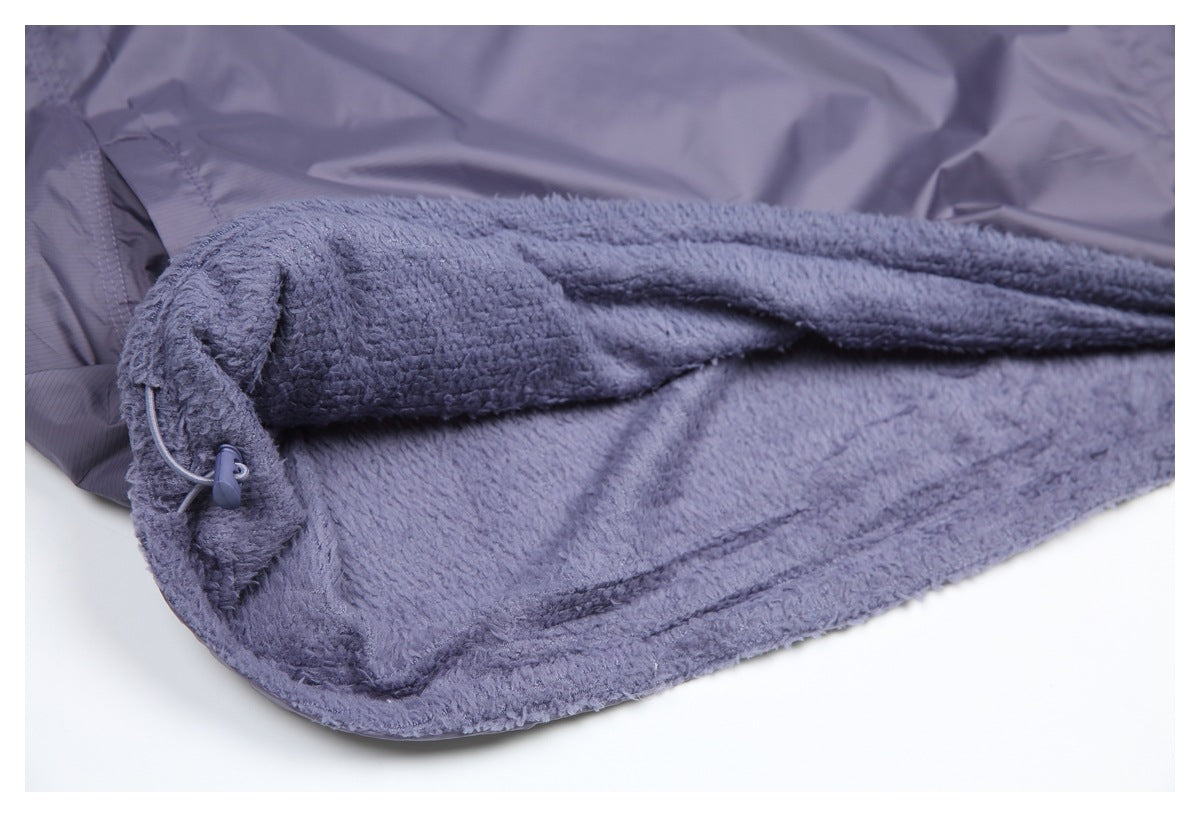 Close-up of the plush grayish lavender lining and finished edge of the jacket.