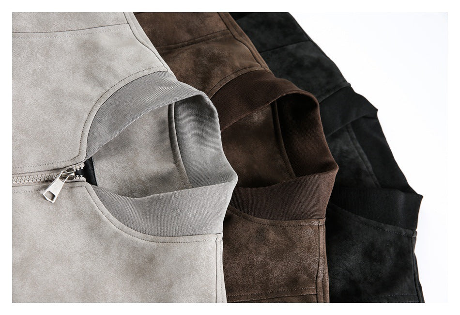 Close-up of overlapping gray, brown, and black jackets showing their collars, zippers, and panel seams.