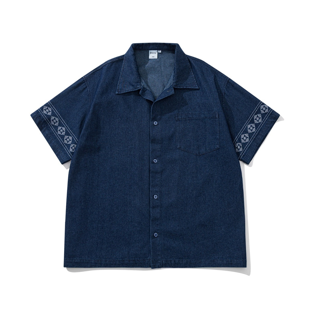 Dark denim-blue short-sleeve button-front shirt with chest pocket and white floral embroidery on the sleeves, flat lay