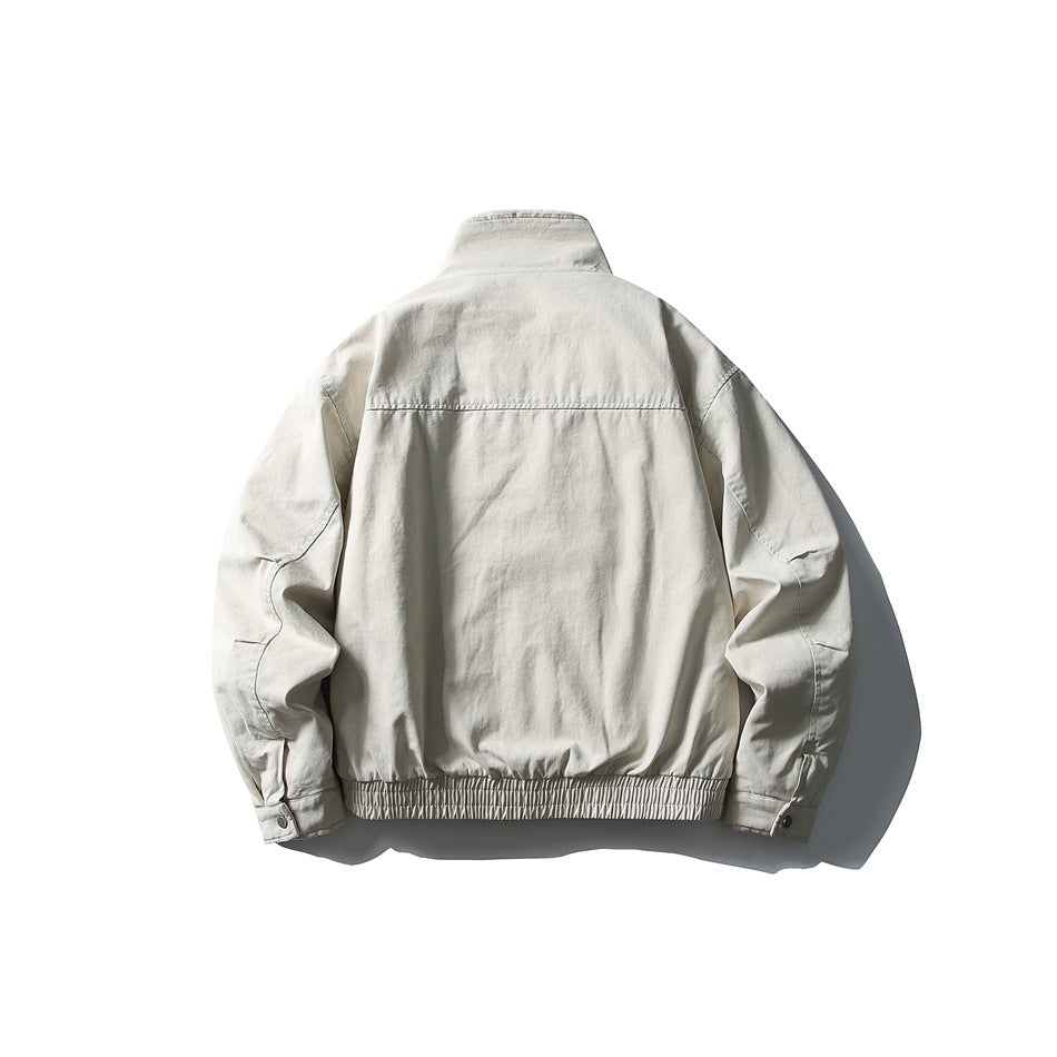 Back view of a light gray jacket with a stand collar, long sleeves, and a gathered elastic hem.