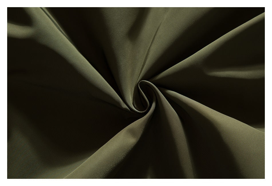 Close-up of olive fabric gathered into soft folds to show its surface and drape.