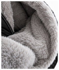 Close-up of the jacket's soft gray plush lining beside the black zipper.