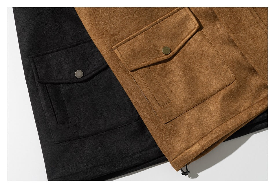 Close-up of black and camel jacket pockets, each with a flap and metal snap.