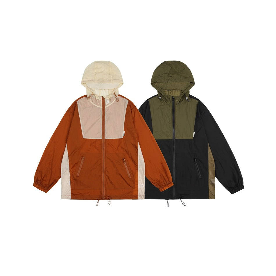 Two hooded color-block windbreakers shown side by side: rust, cream and beige; and black, olive and beige.