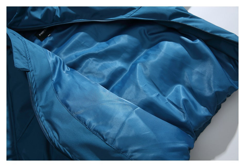 Blue jacket opened to show its glossy blue lining and front zipper.