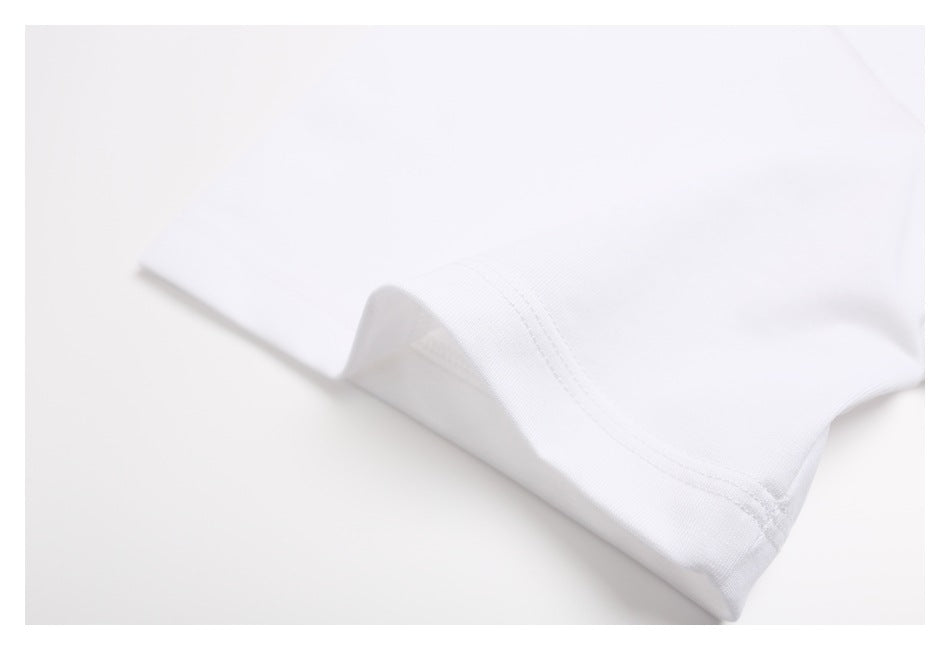 Close-up of the white T-shirt's folded sleeve hem and double-row stitching.
